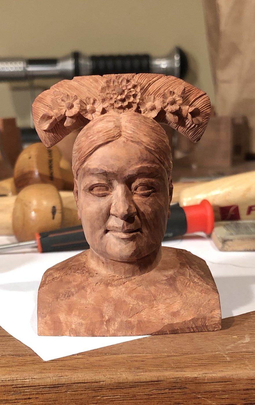 Hand-carved wooden bust by J Drake Customs