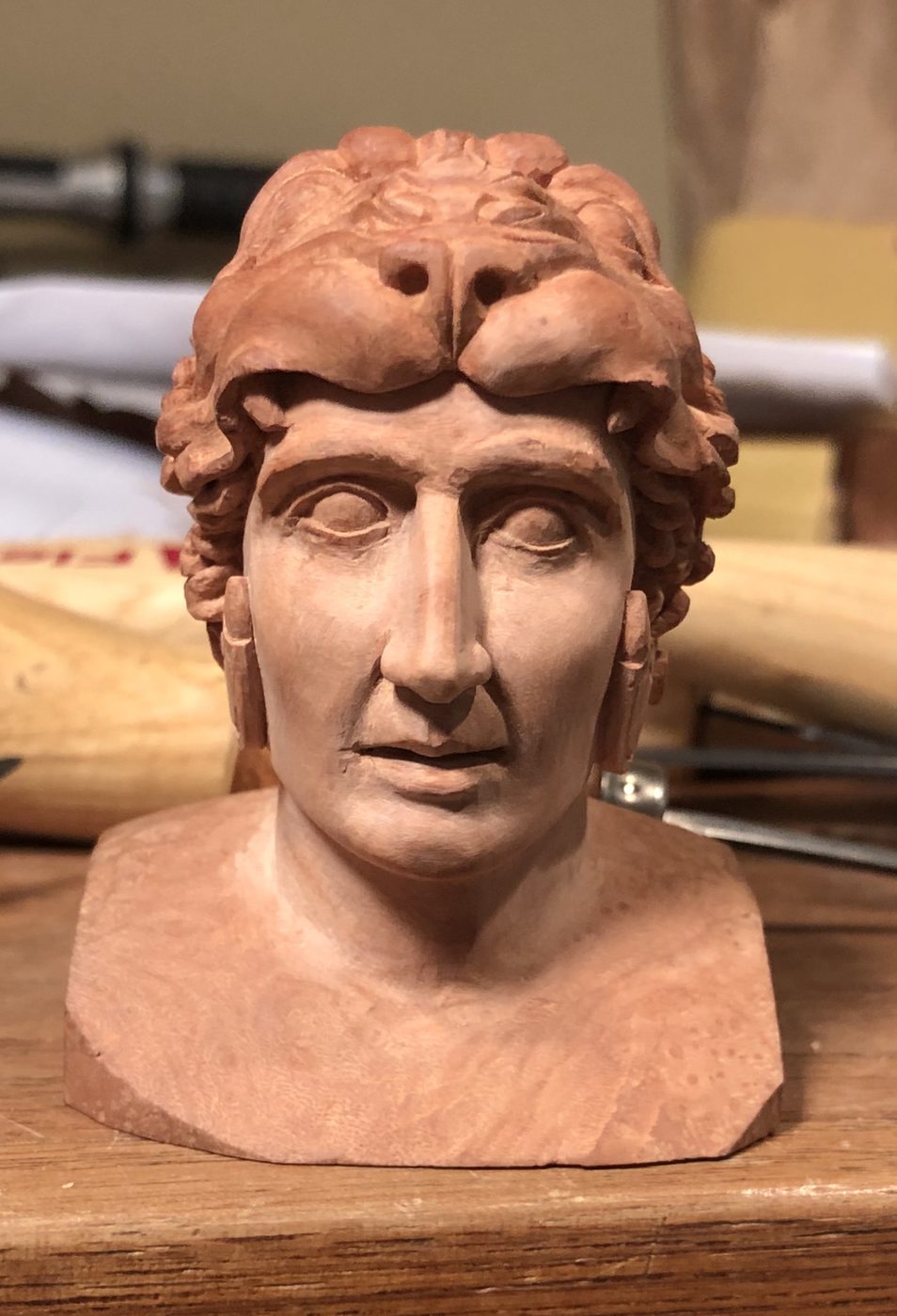 Hand-carved wooden bust by J Drake Customs