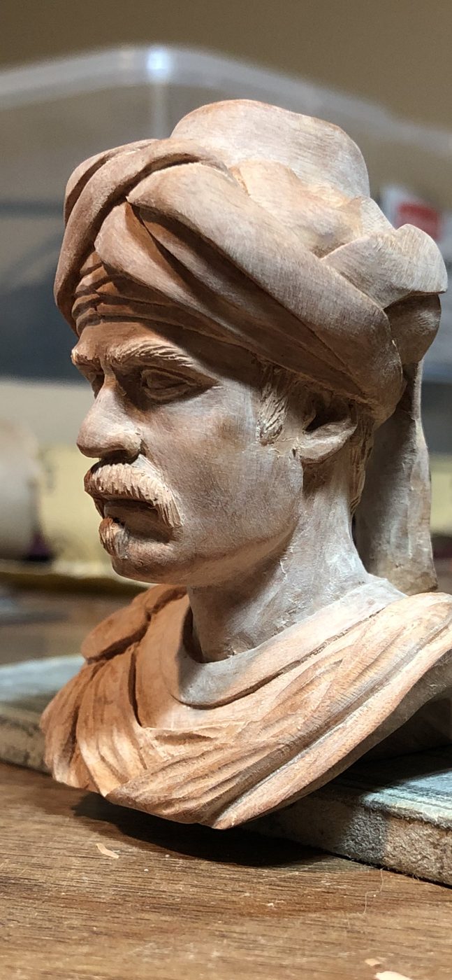 Hand-carved wooden bust by J Drake Customs