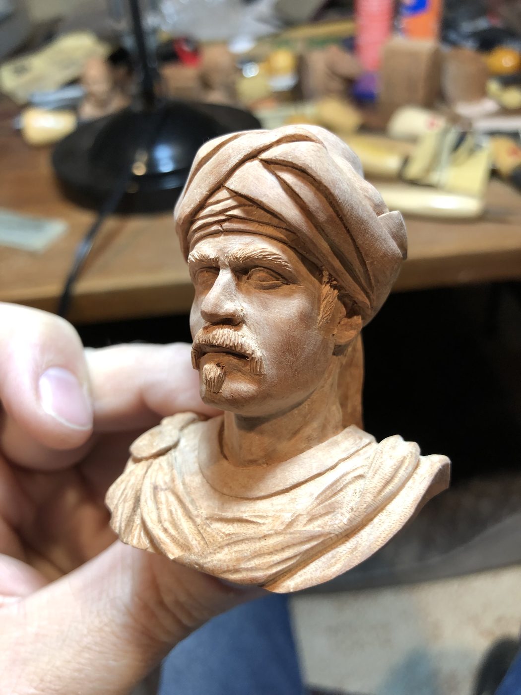 Hand-carved wooden bust by J Drake Customs