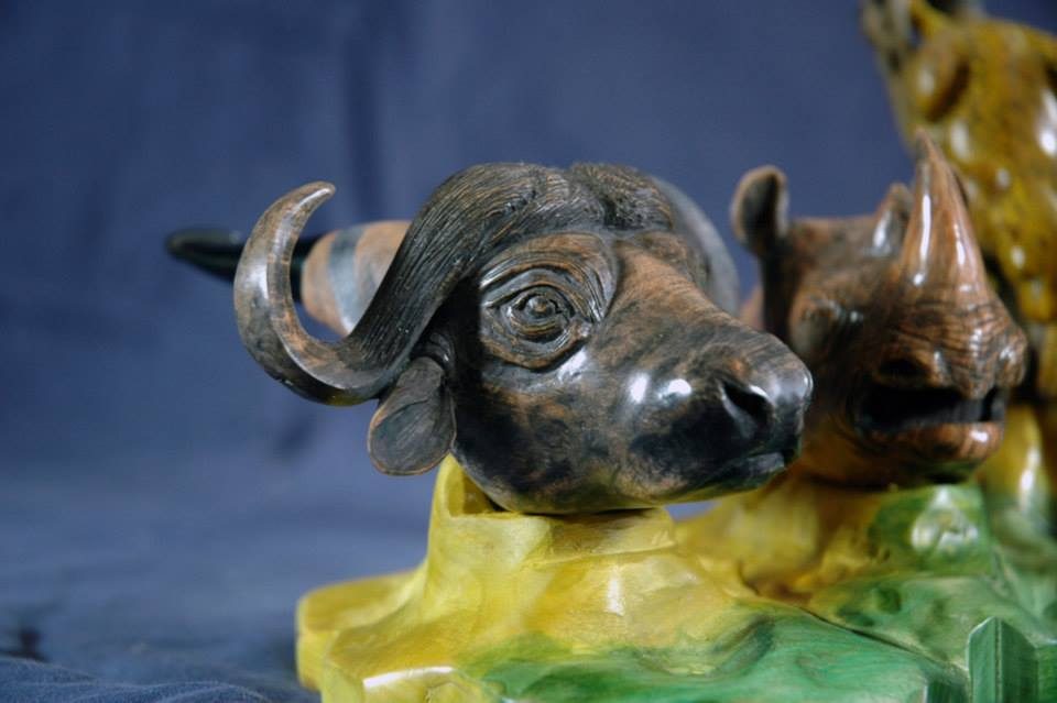 Hand-carved wooden animal sculpture by J Drake Customs