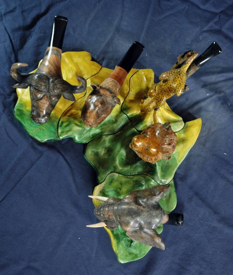 Hand-carved wooden animal sculpture by J Drake Customs