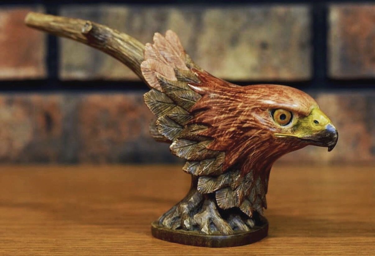 Hand-carved wooden animal sculpture by J Drake Customs