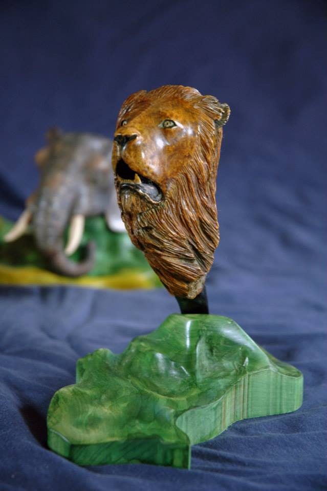 Hand-carved wooden animal sculpture by J Drake Customs