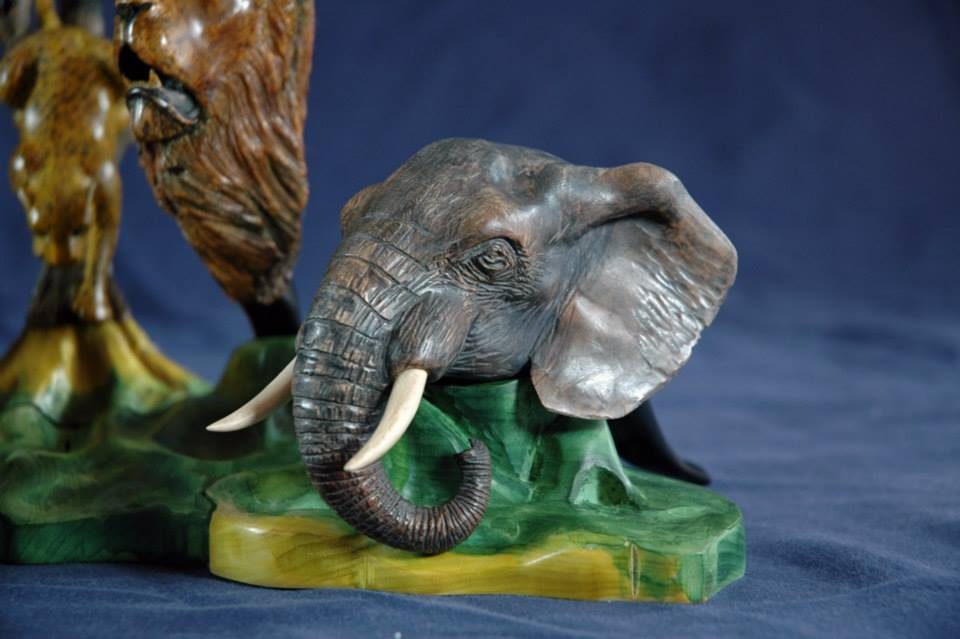 Hand-carved wooden animal sculpture by J Drake Customs