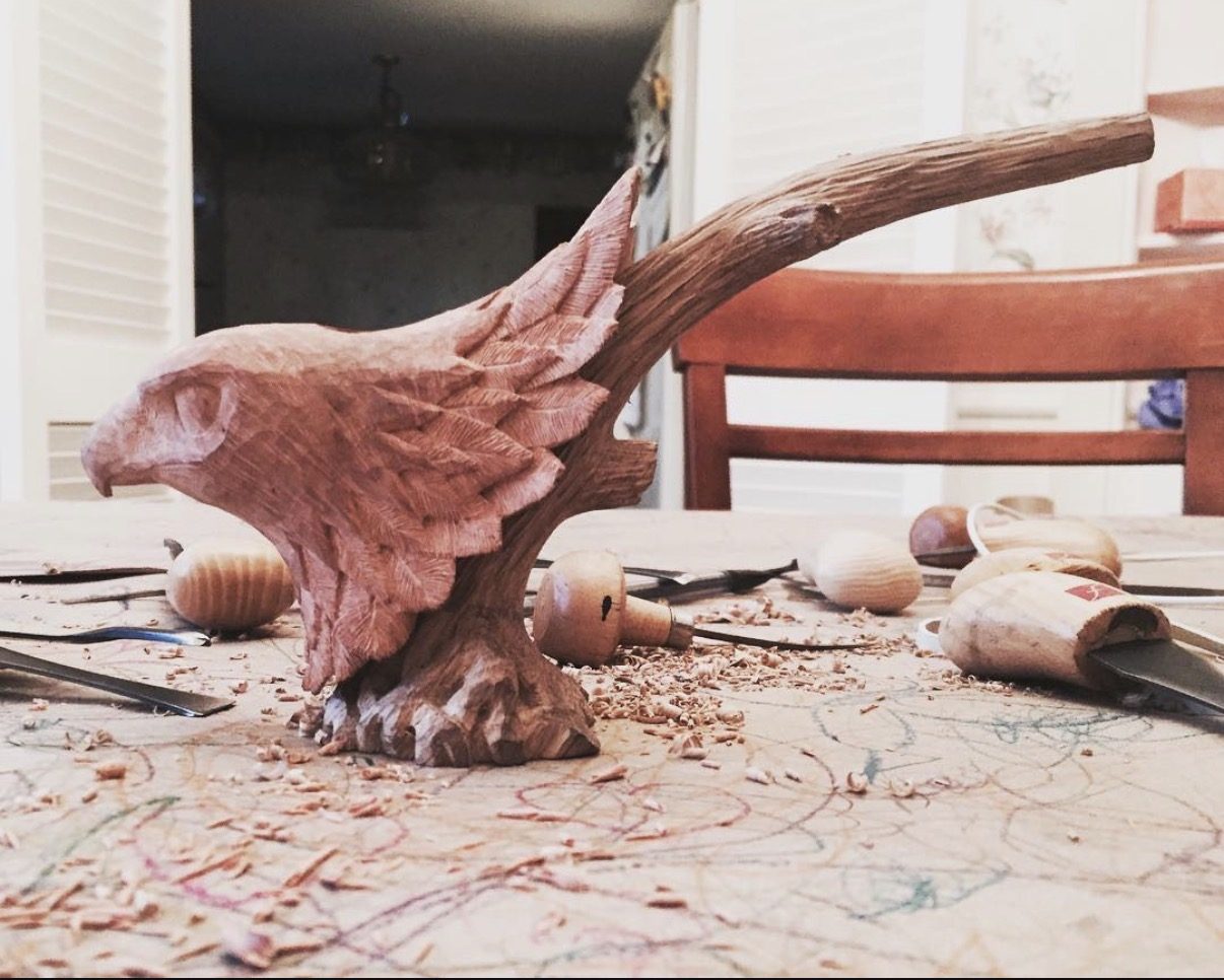 Hand-carved wooden animal sculpture by J Drake Customs