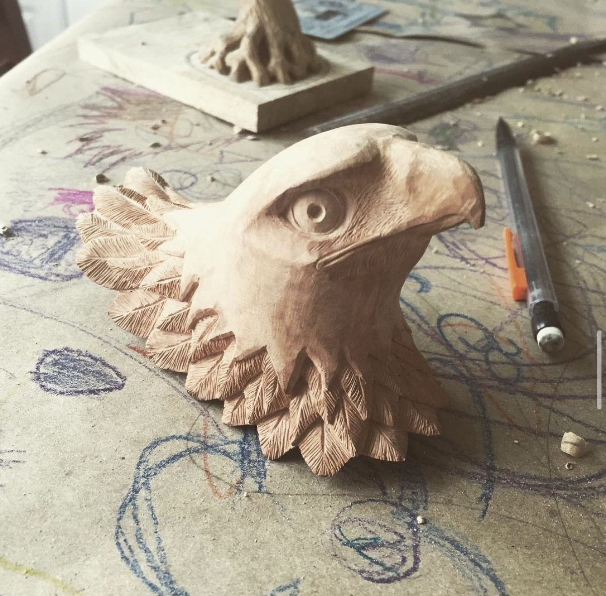 Hand-carved wooden animal sculpture by J Drake Customs