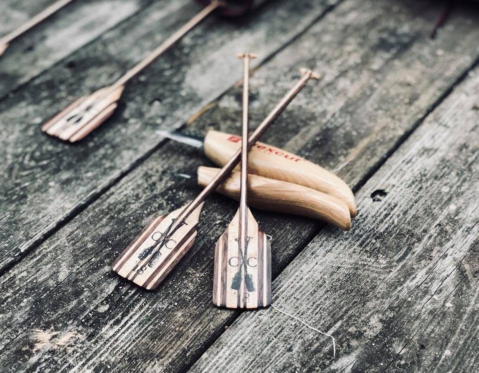 Hand-carved wooden paddles by J Drake Customs